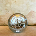 Load image into Gallery viewer, Clear crystal sound bowl with geometric design on a textured surface
