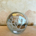 Load image into Gallery viewer, Decorative crystal sound bowl with geometric design on a textured surface