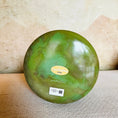 Load image into Gallery viewer, Green Crystal Sound Bowl with a Crystal Tones label on a textured surface