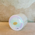 Load image into Gallery viewer, Iridescent Crystal Sound Bowl with a Crystal Tones bowl on a textured surface with a neutral background