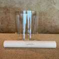 Load image into Gallery viewer, Clear crystal sound bowl with white sonic mallet on a textured surface