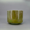 Load image into Gallery viewer, 8-inch Crystal Tones® Itoigawa Jade Alchemy™ crystal singing bowl in F +45, photographed in natural light.