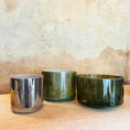 Load image into Gallery viewer, Three crystal sound bowls of different sizes on a textured surface
