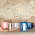 Load image into Gallery viewer, Four Crystal Sound Bowls on a textured surface with a textured wall background
