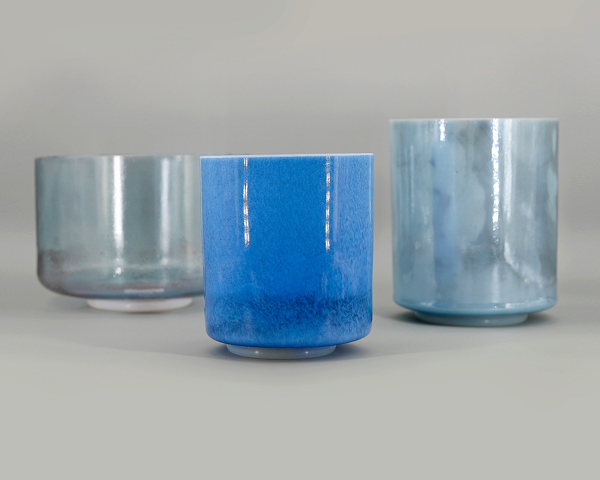 Starwater Full Set of three crystal sound bowls with blue glaze on a grey background