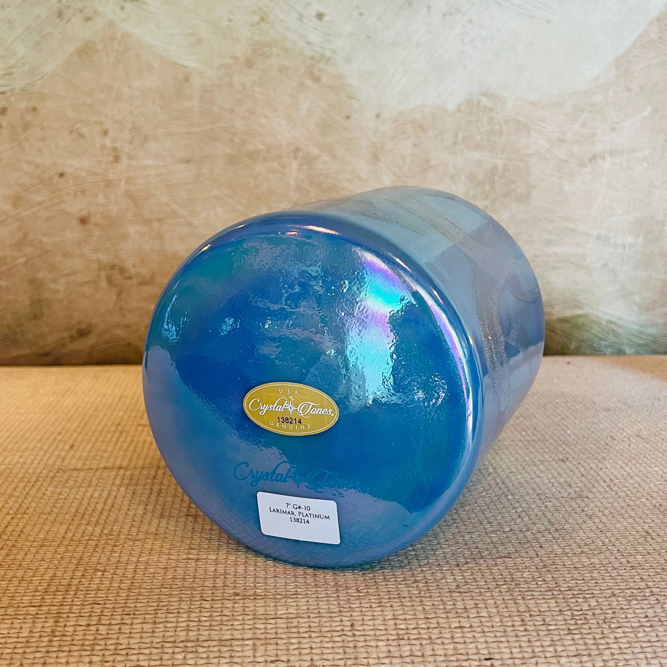 Blue Crystal Sound Bowl with a Crystal Tones brand label on a textured surface