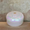 Load image into Gallery viewer, Iridescent crystal sound bowl with a Crystal Tones label on a textured surface
