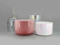 Load image into Gallery viewer, Four crystal sound bowl in pink, white, and clear glass on a gray background
