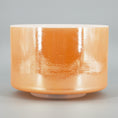Load image into Gallery viewer, Orange Crystal sound bowl with a glossy finish on a gray background
