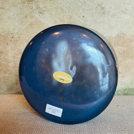 Blue Crystal Sound Bowl with a visible Crystal Tones brand label on a textured surface