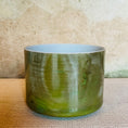 Load image into Gallery viewer, Green Crystal Sound Bowl on a textured surface with a neutral background
