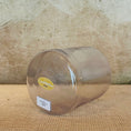 Load image into Gallery viewer, Clear crystal sound bowl with a Crystal Tones label on a wooden surface
