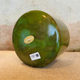 Load image into Gallery viewer, Green Crystal Sound Bowl with a visible Crystal Tones brand label on a textured surface

