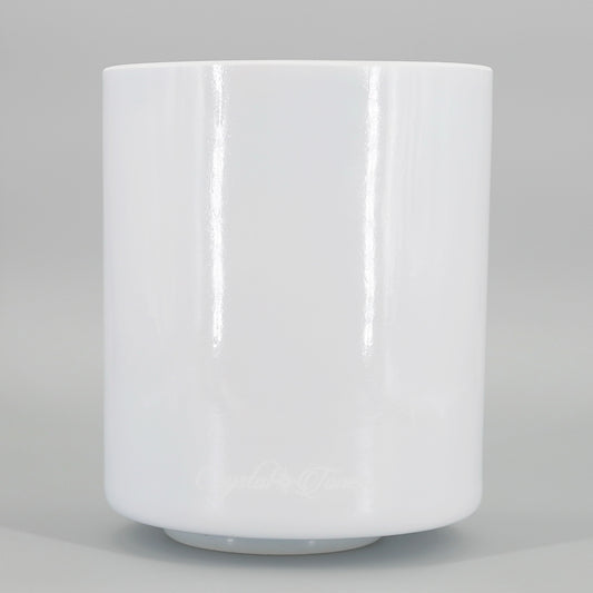 White crystal sound bowl on a gray background