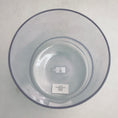 Load image into Gallery viewer, Inside view of a clear crystal sound bowl with a label on a light gray background
