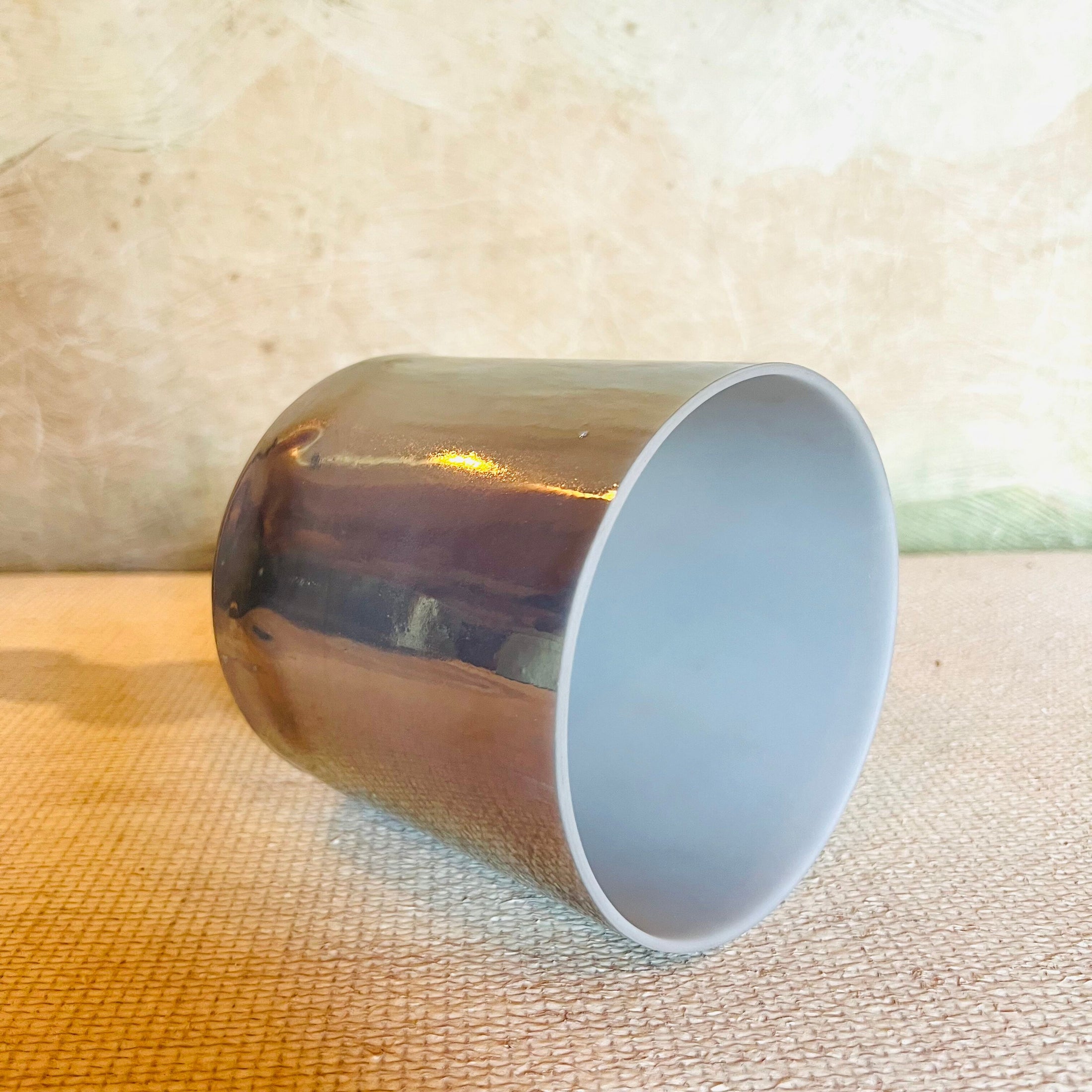 Metallic Crystal Sound Bowl on a textured surface