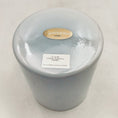 Load image into Gallery viewer, Round crystal sound bowl with a label on a light gray background
