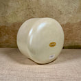 Load image into Gallery viewer, White crystal sound bowl with a gold Crystal Tones label on a textured surface

