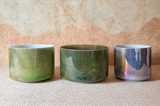 Earthsong harmonised Crystal Tones® Alchemy™ bowl set with Chrysoprase, Itoigawa Jade and Charcoal Palladium bowls arranged together.