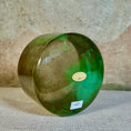 Load image into Gallery viewer, Green crystal sound bowl with a Crystal Tones label on a textured surface
