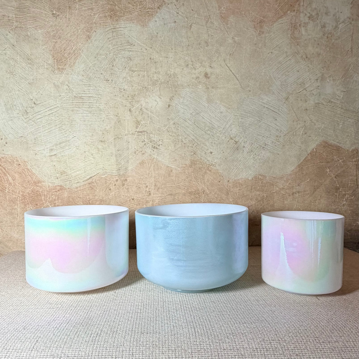 Aphrodite harmonised Crystal Tones® Alchemy™ bowl set with Ocean Gold and two Mother of Platinum bowls.
