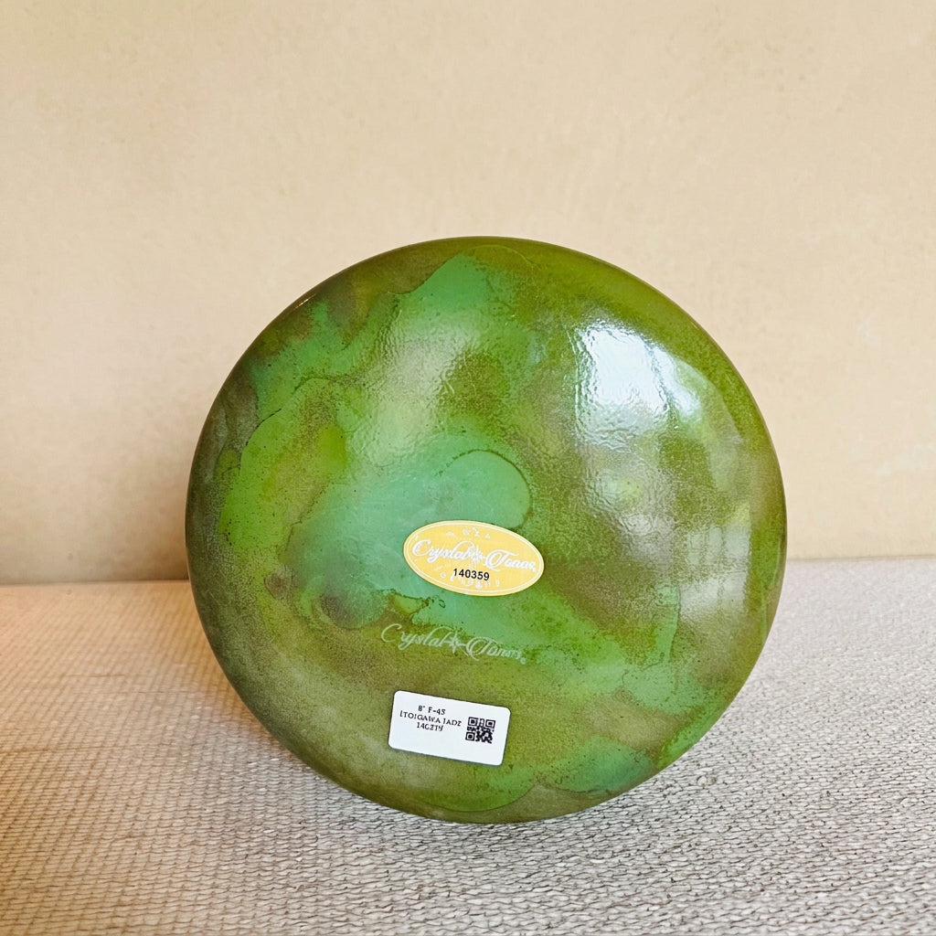Bottomview of an 8-inch Crystal Tones® Itoigawa Jade Alchemy™ crystal singing bowl in F +45, showing its deep green marbled finish.