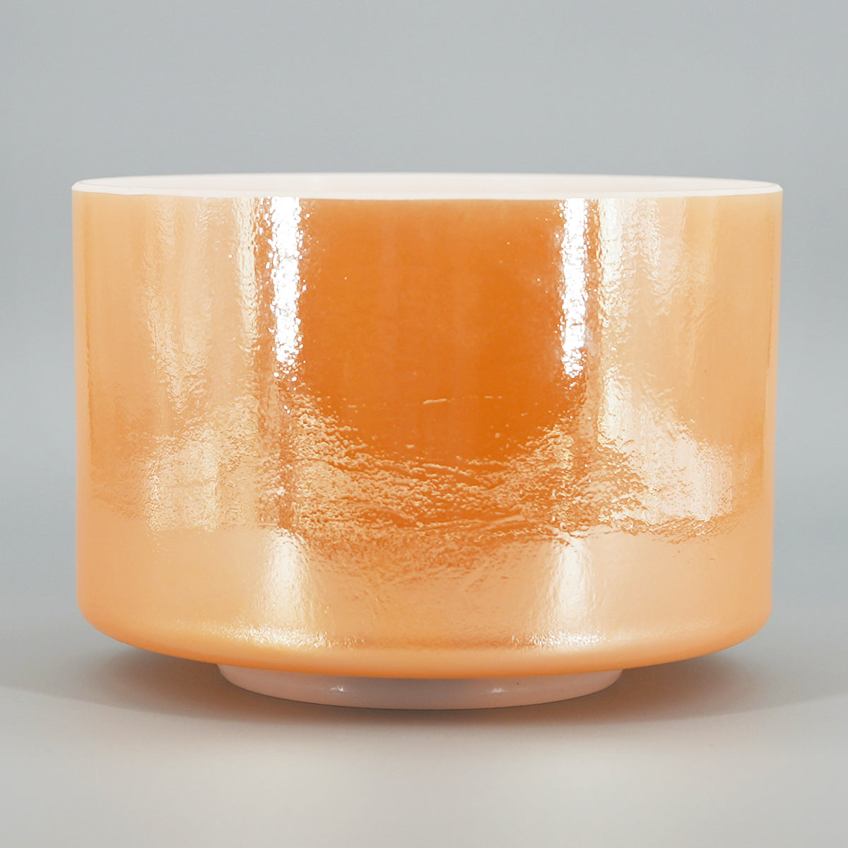 Crystal Tones® Laughing Buddha 8-inch G +5 singing bowl from the original Sacred Sunrise arrangement on grey background. 