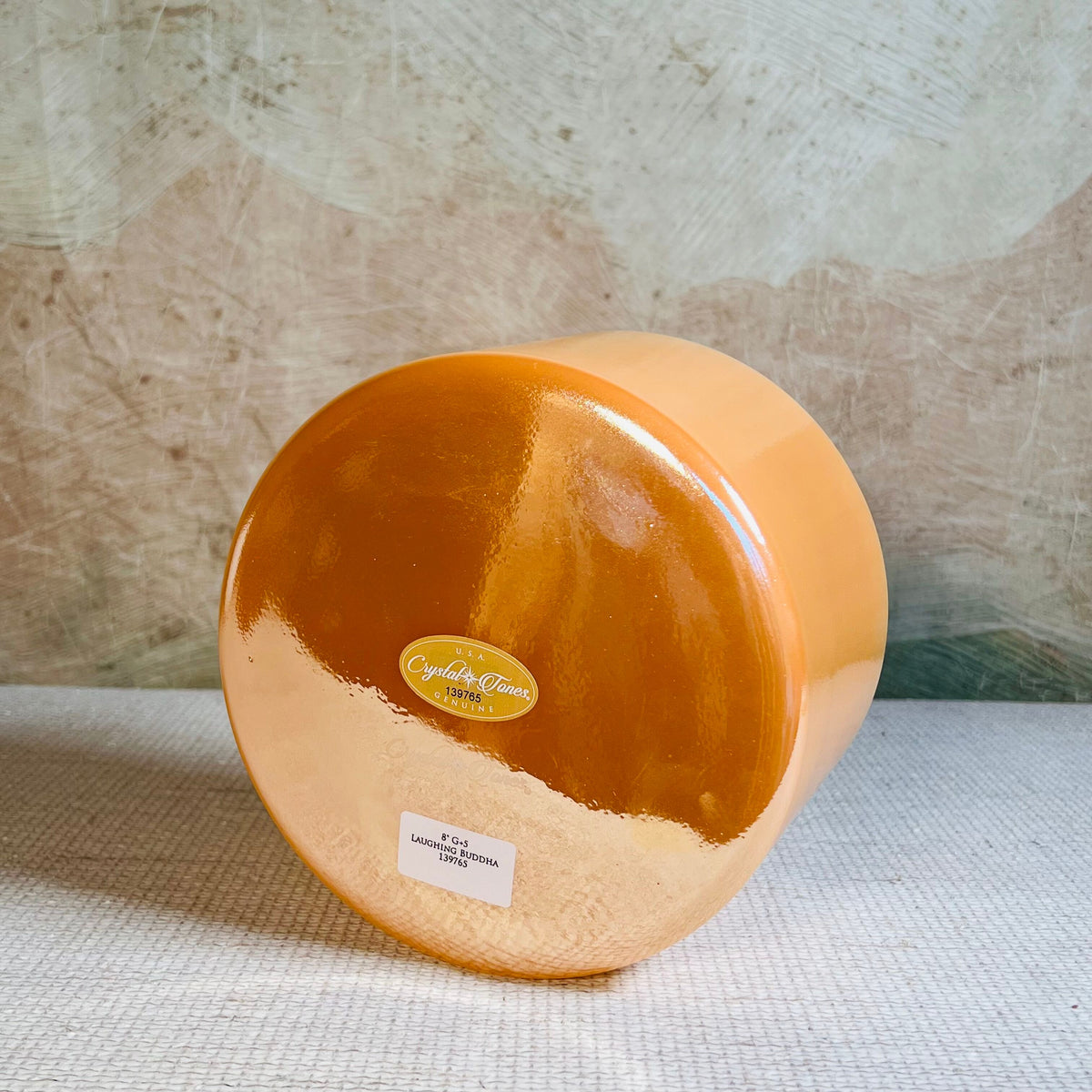 Side view of Crystal Tones® Laughing Buddha 8-inch G +5 singing bowl from the original Sacred Sunrise arrangement.