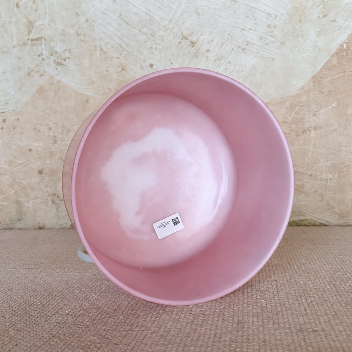 Interior view of the Rose Quartz Palladium 9-inch singing bowl, showing its pale pink finish.